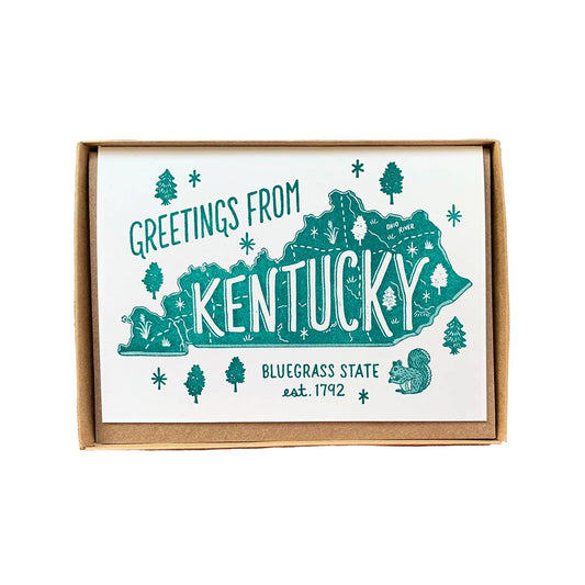 Framed print with 'Greetings from Kentucky' text and state outline on a white background